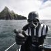 PORTMAGEE, IRELAND - MAY 04: A Star Wars fan dressed as the character Darth Vader takes a boat trip to the Skelligs on International Star Wars day May 4, 2018 in Portmagee, Ireland. The first ever Star Wars festival is taking place against the backdrop of the famous Skellig Michael island which was used extensively in Episode VII and Episode VIII of the popular science fiction saga. The small fishing village of Portmagee, which is closest to the location, has seen a boom in tourism following the latest films. The vilage will host a Star Wars drive-in and a Star Wars themed Irish dancing competition over the weekend. Today is known as 'May the fourth be with you' day. (Photo by Charles McQuillan/Getty Images)